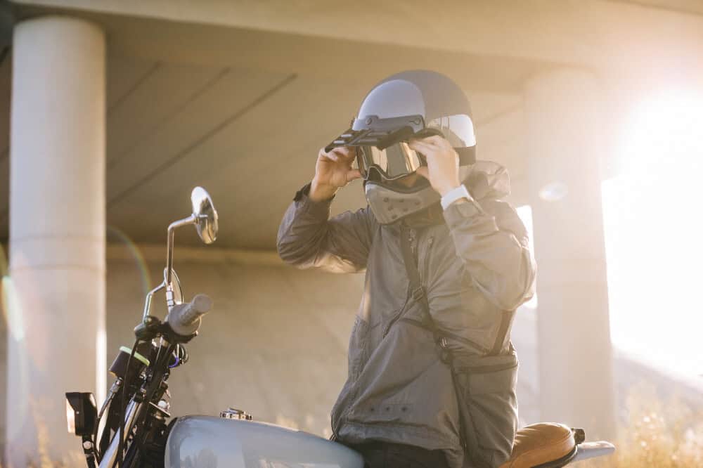 motorcyclist wearing helmet before accident in need of Oregon motorcycle accident lawyer