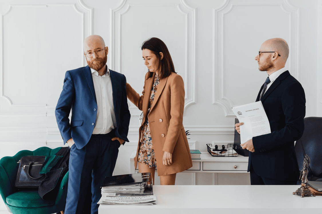 Sad people standing in lawyer's office